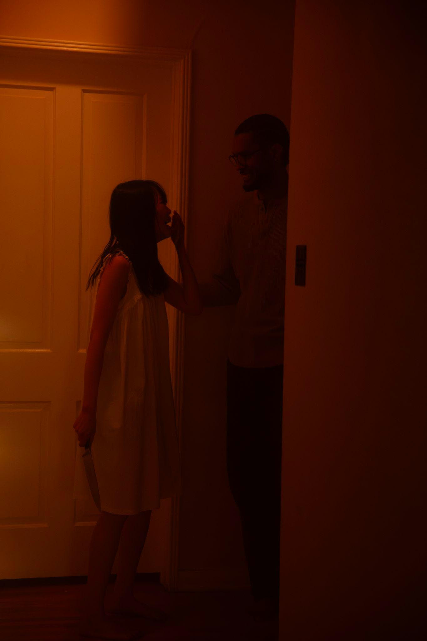 Alice Lee and John Thomas Benson rehearse in the hallway.